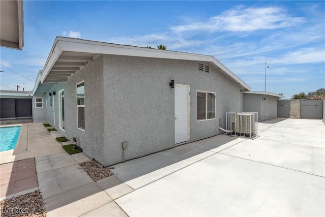 4404 Hillcrest Ave, Las Vegas, NV 89102 - back of property featuring a patio area, stucco siding, and central AC unit