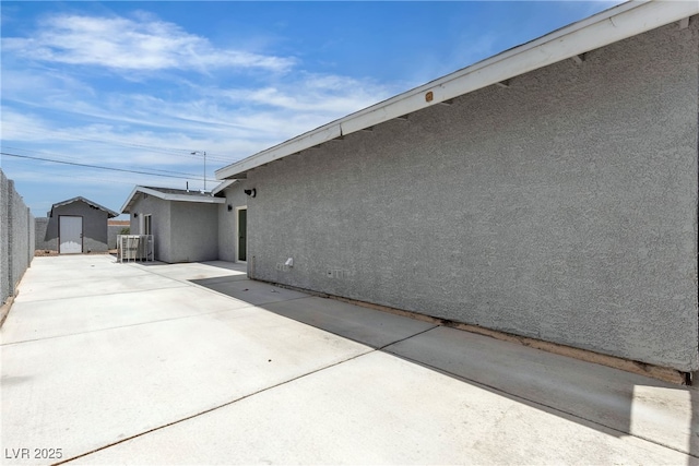 4404 Hillcrest Ave, Las Vegas, NV 89102 - view of property exterior featuring stucco siding, a patio, and central AC unit