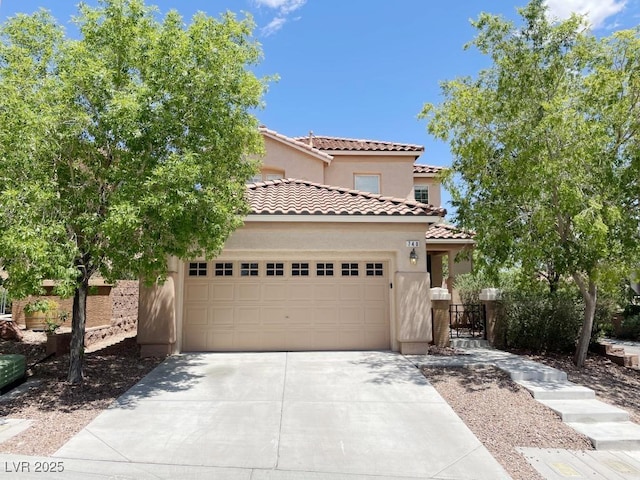 740 White Grotto St, Las Vegas, NV 89138 - mediterranean / spanish house with driveway, stucco siding, a garage, and a tile roof