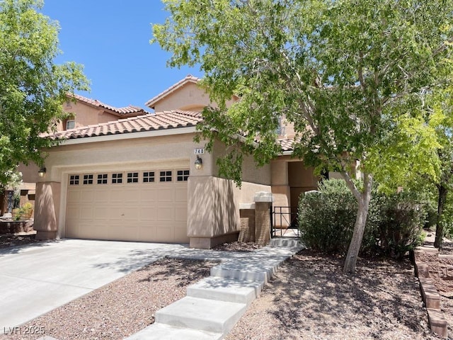 740 White Grotto St, Las Vegas, NV 89138 - view of front of home with driveway, stucco siding, a garage, and a tile roof