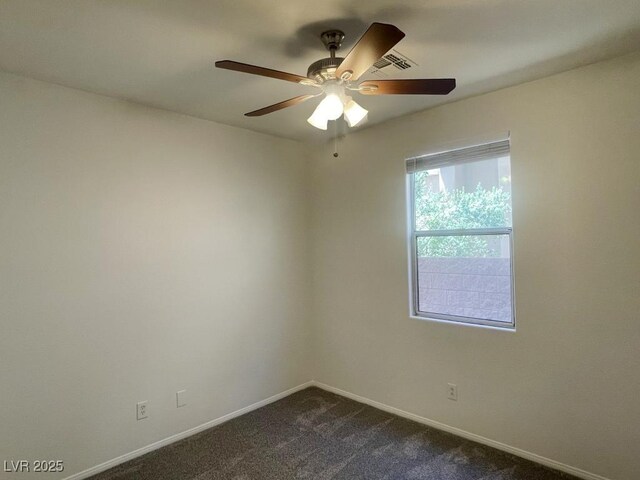 740 White Grotto St, Las Vegas, NV 89138 - unfurnished room with baseboards, a ceiling fan, and dark carpet