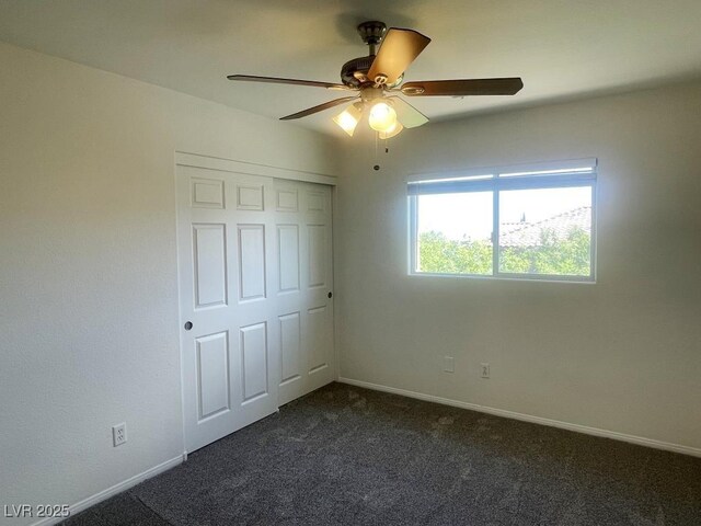 740 White Grotto St, Las Vegas, NV 89138 - unfurnished bedroom with dark colored carpet, baseboards, a closet, and ceiling fan