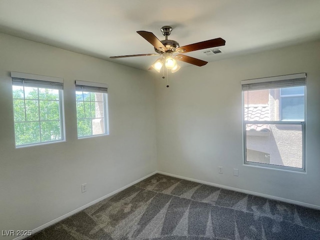 740 White Grotto St, Las Vegas, NV 89138 - unfurnished room featuring healthy amount of natural light, dark carpet, baseboards, and ceiling fan