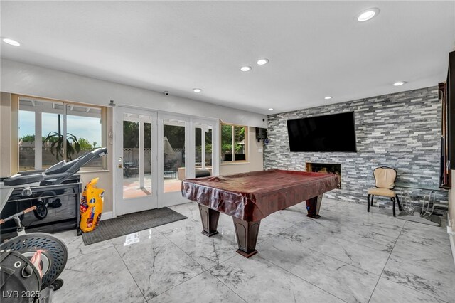 601 Cragin Park Dr, Las Vegas, NV 89107 - game room featuring french doors, recessed lighting, marble finish flooring, a fireplace, and billiards