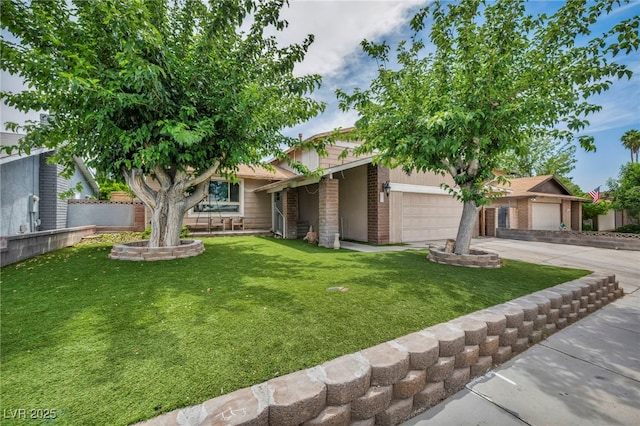 601 Cragin Park Dr, Las Vegas, NV 89107 - view of front facade featuring a garage, concrete driveway, and brick siding