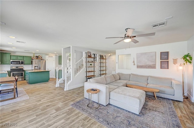 412 Orchid Oasis Ave, North Las Vegas, NV 89031 - living area featuring stairs, light wood-type flooring, a ceiling fan, and recessed lighting