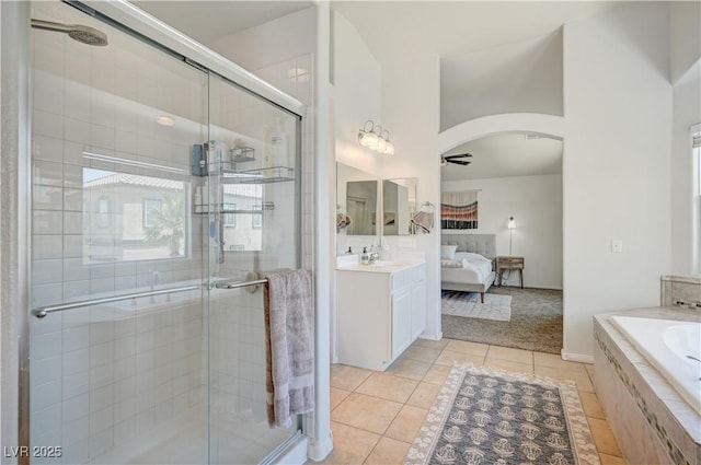 412 Orchid Oasis Ave, North Las Vegas, NV 89031 - bathroom with connected bathroom, a stall shower, and tile patterned floors