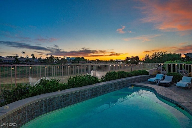 499 Eagle Vista Dr, Henderson, NV 89012 - pool at dusk with a fenced backyard
