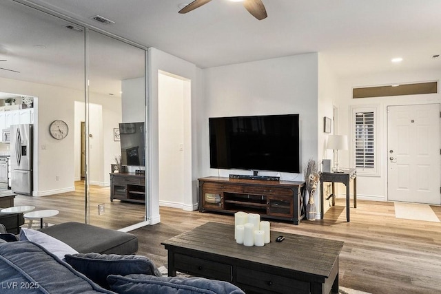 499 Eagle Vista Dr, Henderson, NV 89012 - living room with a ceiling fan, light wood-type flooring, baseboards, and recessed lighting