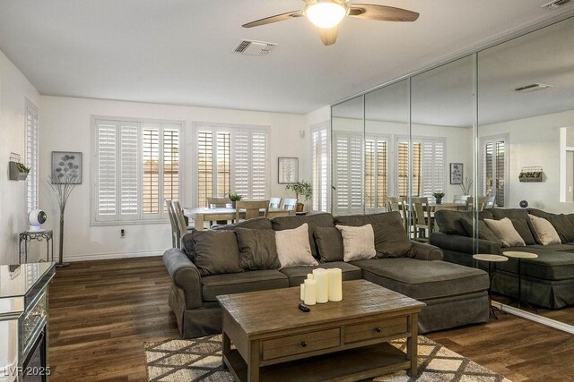 499 Eagle Vista Dr, Henderson, NV 89012 - living room featuring ceiling fan, dark wood-style floors, and baseboards
