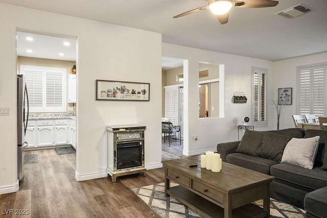 499 Eagle Vista Dr, Henderson, NV 89012 - living area with a ceiling fan, wood finished floors, baseboards, and recessed lighting