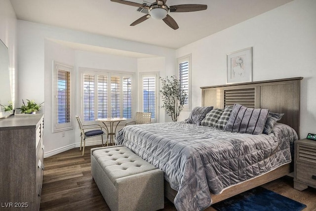 499 Eagle Vista Dr, Henderson, NV 89012 - bedroom featuring dark wood-style flooring, baseboards, and a ceiling fan