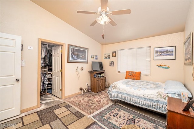 475 E Robindale Rd, Las Vegas, NV 89123 - bedroom with lofted ceiling, baseboards, a ceiling fan, and a spacious closet