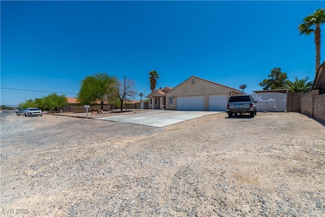 475 E Robindale Rd, Las Vegas, NV 89123 - view of front of house with concrete driveway and a garage