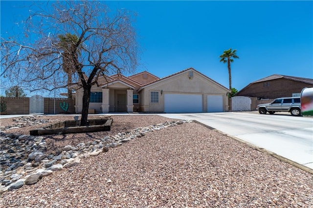 475 E Robindale Rd, Las Vegas, NV 89123 - single story home with concrete driveway, a garage, and stucco siding