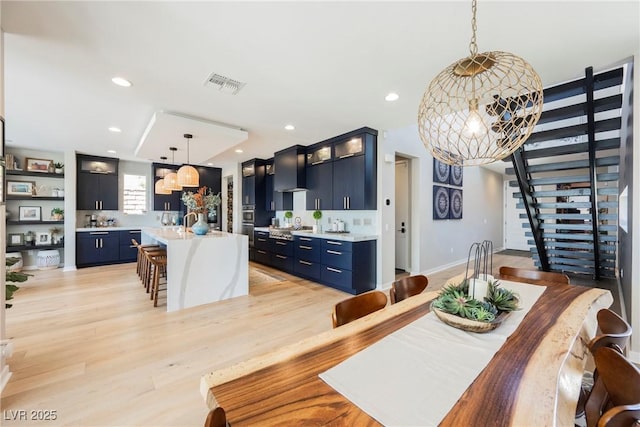2750 Evolutionary Ln, Las Vegas, NV 89138 - dining space with stairs, light wood finished floors, recessed lighting, and baseboards