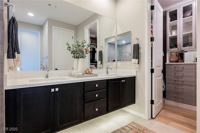 2750 Evolutionary Ln, Las Vegas, NV 89138 - full bath with double vanity, a walk in closet, tile patterned flooring, and baseboards