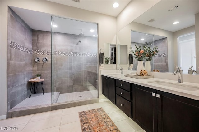 2750 Evolutionary Ln, Las Vegas, NV 89138 - bathroom featuring double vanity, walk in shower, tile patterned floors, and recessed lighting