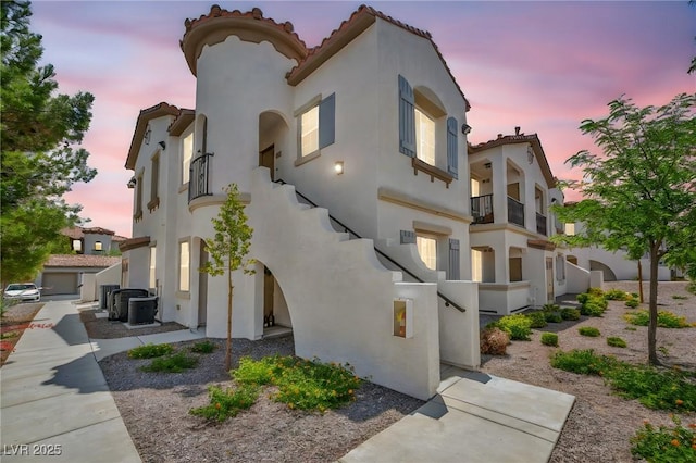 50 Aura De Blanco St Unit 2104, Henderson, NV 89074 - view of front of property featuring a tiled roof, stucco siding, and a balcony