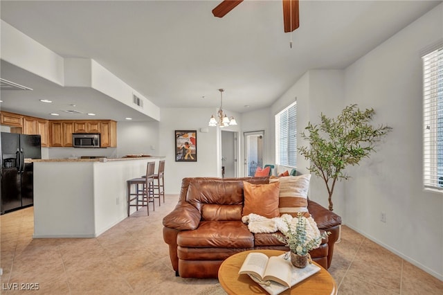 50 Aura De Blanco St Unit 2104, Henderson, NV 89074 - living area with light tile patterned floors, a chandelier, a ceiling fan, baseboards, and recessed lighting