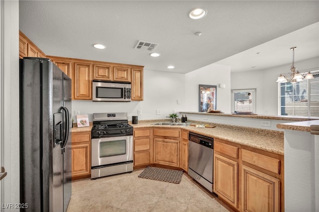 50 Aura De Blanco St Unit 2104, Henderson, NV 89074 - kitchen with appliances with stainless steel finishes, a sink, a peninsula, recessed lighting, and a chandelier