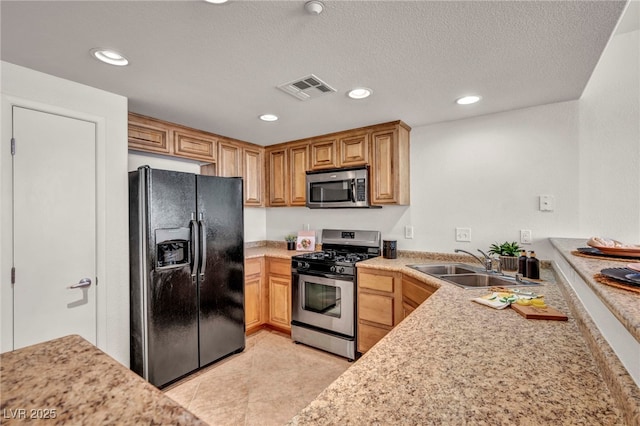 50 Aura De Blanco St Unit 2104, Henderson, NV 89074 - kitchen featuring appliances with stainless steel finishes, light countertops, a sink, recessed lighting, and light tile patterned flooring