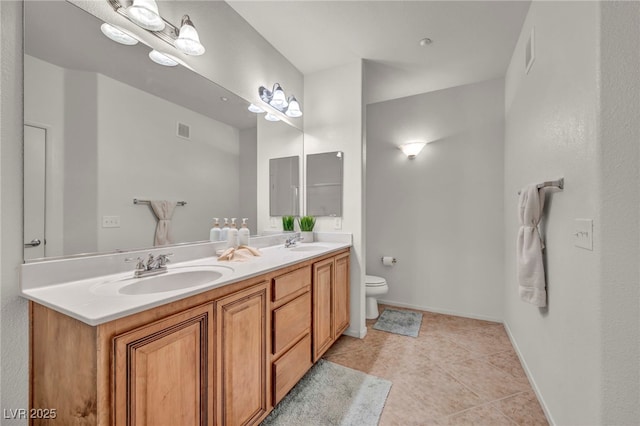50 Aura De Blanco St Unit 2104, Henderson, NV 89074 - bathroom with toilet, double vanity, tile patterned flooring, and baseboards