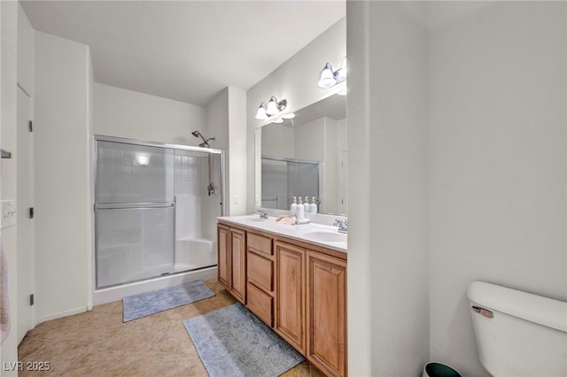 50 Aura De Blanco St Unit 2104, Henderson, NV 89074 - bathroom featuring double vanity, a shower with door, toilet, and tile patterned flooring