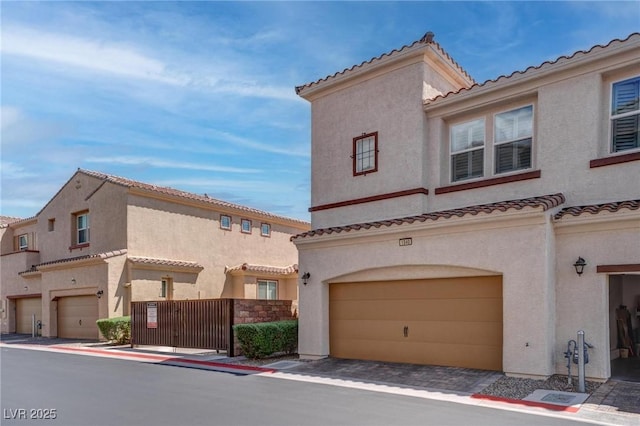 1040 Via Panfilo Ave, Henderson, NV 89011 - view of front facade with a garage, stucco siding, and a tile roof