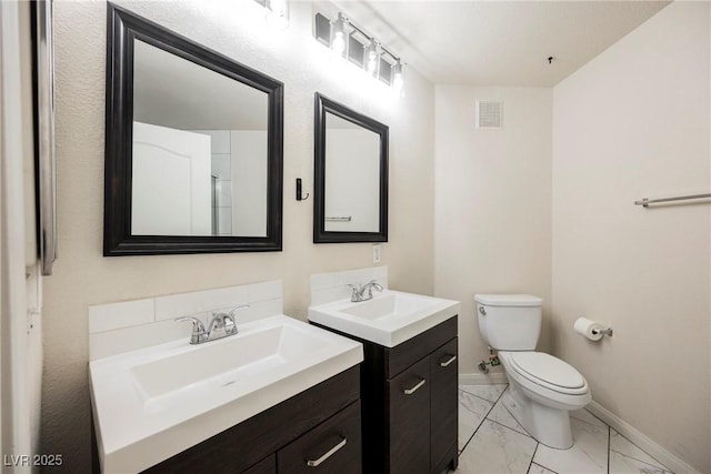 7400 W Flamingo Rd Unit 1082, Las Vegas, NV 89147 - bathroom featuring marble finish floors and two vanities