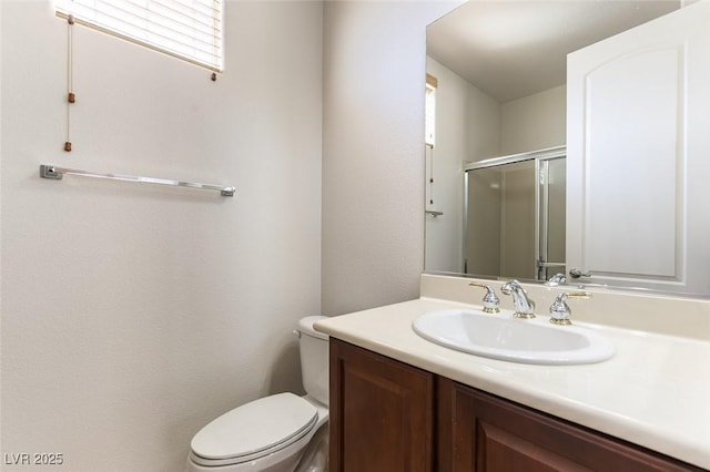 2373 Ozark Plateau Dr, Henderson, NV 89044 - bathroom featuring toilet, vanity, and an enclosed shower