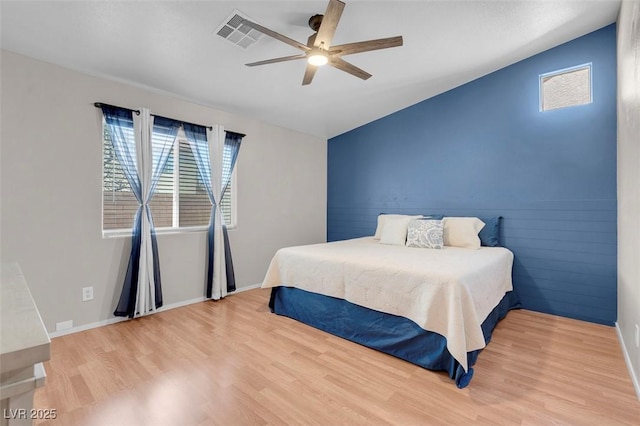 509 Regal Robin Way N, Las Vegas, NV 89084 - bedroom with wood finished floors, lofted ceiling, ceiling fan, and baseboards