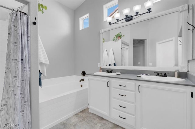509 Regal Robin Way N, Las Vegas, NV 89084 - full bath featuring a garden tub, double vanity, a chandelier, and a shower with shower curtain