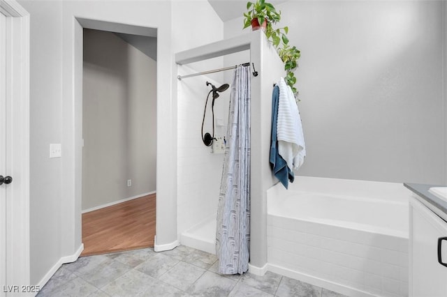509 Regal Robin Way N, Las Vegas, NV 89084 - bathroom with a tile shower, vanity, baseboards, and a tub