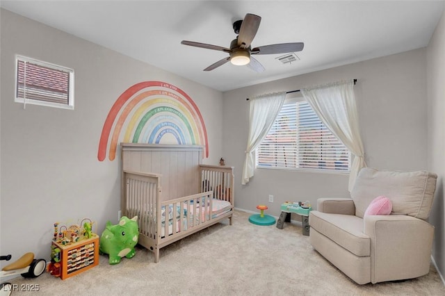 509 Regal Robin Way N, Las Vegas, NV 89084 - bedroom with a nursery area, carpet, and a ceiling fan