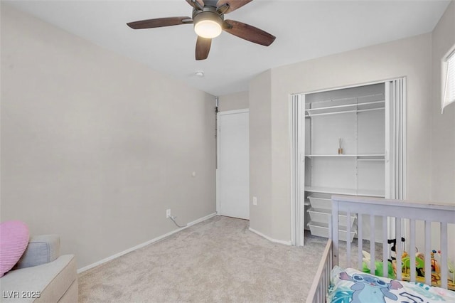 509 Regal Robin Way N, Las Vegas, NV 89084 - unfurnished bedroom with carpet, a closet, baseboards, and ceiling fan