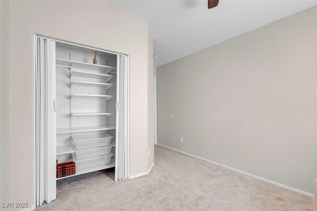 509 Regal Robin Way N, Las Vegas, NV 89084 - unfurnished bedroom with carpet flooring, baseboards, a closet, and ceiling fan