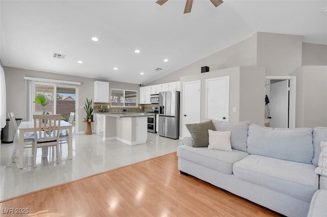 509 Regal Robin Way N, Las Vegas, NV 89084 - living area featuring ceiling fan, lofted ceiling, recessed lighting, and light wood-style flooring