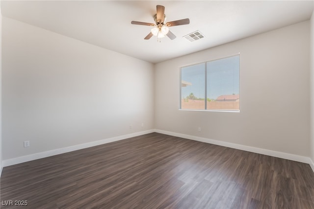 6140 Passionate Ct, North Las Vegas, NV 89031 - unfurnished room with dark wood-type flooring, a ceiling fan, and baseboards