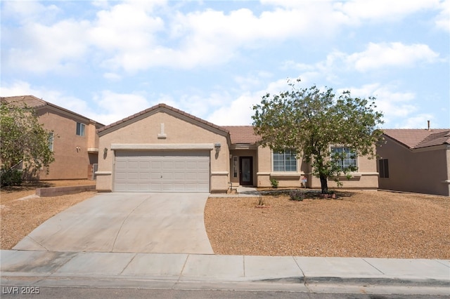 6140 Passionate Ct, North Las Vegas, NV 89031 - ranch-style house with an attached garage, concrete driveway, stucco siding, and a tile roof