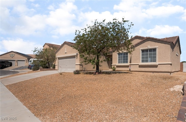 6140 Passionate Ct, North Las Vegas, NV 89031 - view of front of house featuring concrete driveway, stucco siding, a tiled roof, and an attached garage