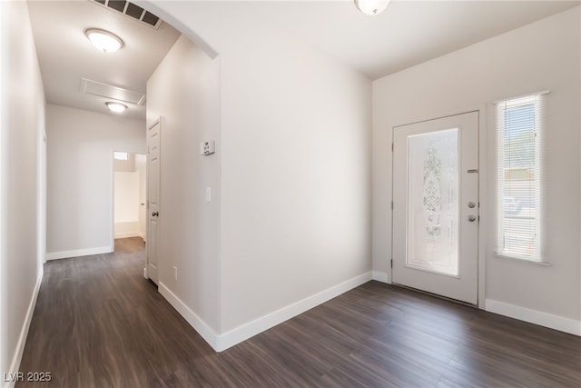6140 Passionate Ct, North Las Vegas, NV 89031 - foyer entrance with dark wood-type flooring, arched walkways, and healthy amount of natural light