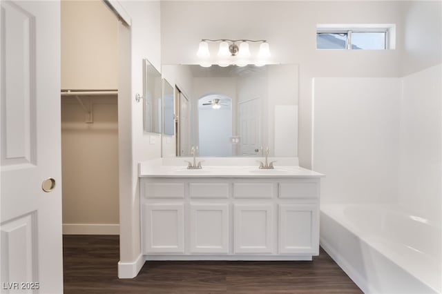 6140 Passionate Ct, North Las Vegas, NV 89031 - full bath with wood finished floors, double vanity, and baseboards