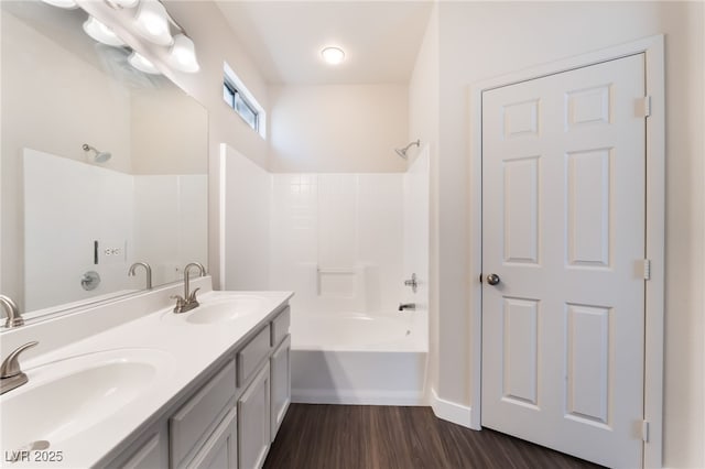 6140 Passionate Ct, North Las Vegas, NV 89031 - bathroom featuring double vanity, wood finished floors, and bathtub / shower combination