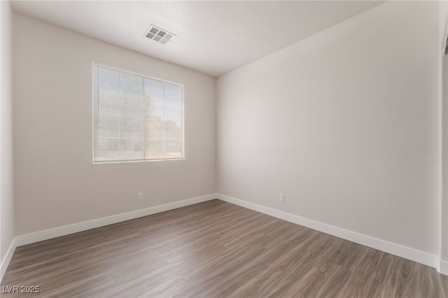 6140 Passionate Ct, North Las Vegas, NV 89031 - unfurnished room featuring wood finished floors and baseboards