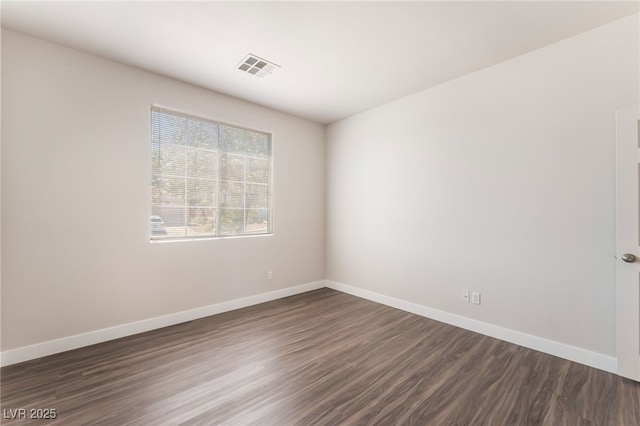 6140 Passionate Ct, North Las Vegas, NV 89031 - empty room with dark wood-style floors and baseboards