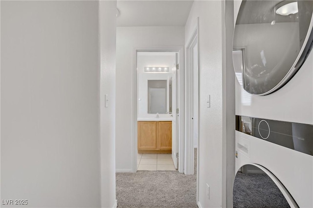 5135 Paradise Valley Ave, Las Vegas, NV 89156 - laundry area featuring estacked washer and dryer, light carpet, and baseboards