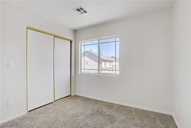 5135 Paradise Valley Ave, Las Vegas, NV 89156 - unfurnished bedroom with carpet, baseboards, and a closet