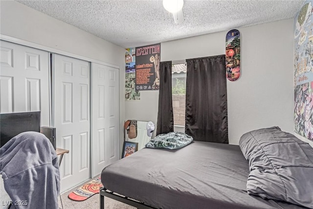 3417 Lillis Cir, North Las Vegas, NV 89030 - bedroom featuring a textured ceiling, a closet, and carpet flooring