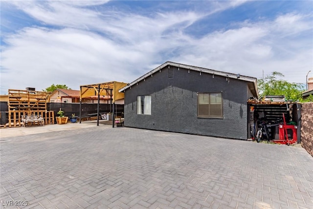 3417 Lillis Cir, North Las Vegas, NV 89030 - view of property exterior with stucco siding and a patio